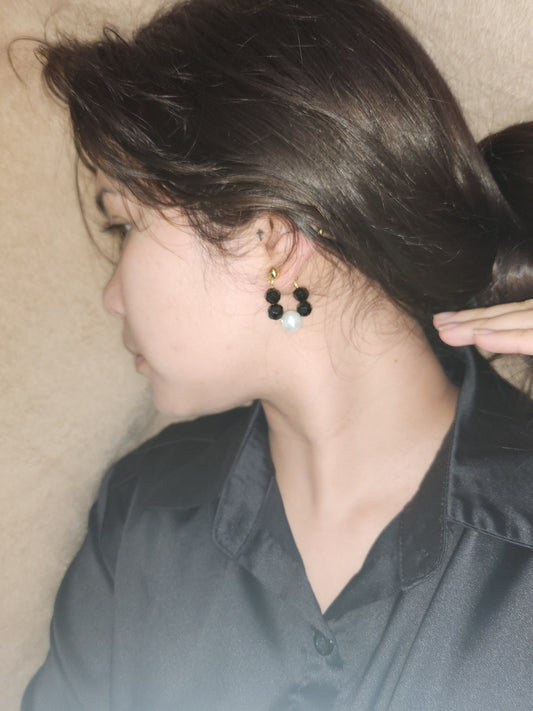 Black with pearl earrings